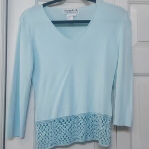 Baby blue beaded sweater.